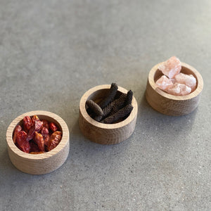 029 SPICE BOWLS -three bowls in natural oak. himalayan rock salt, java long peppers and bird's eye chili testers. sleek flat gift pack.